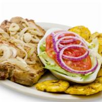 Pork Chops · 2 grilled pork chops topped with cooked onions.  Served with pico de gallo, 2 side orders an...