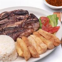 Tira De Asado (Grilled Short Rib) · 3 grilled short ribs, served with 2 side orders and 1 tortilla.
