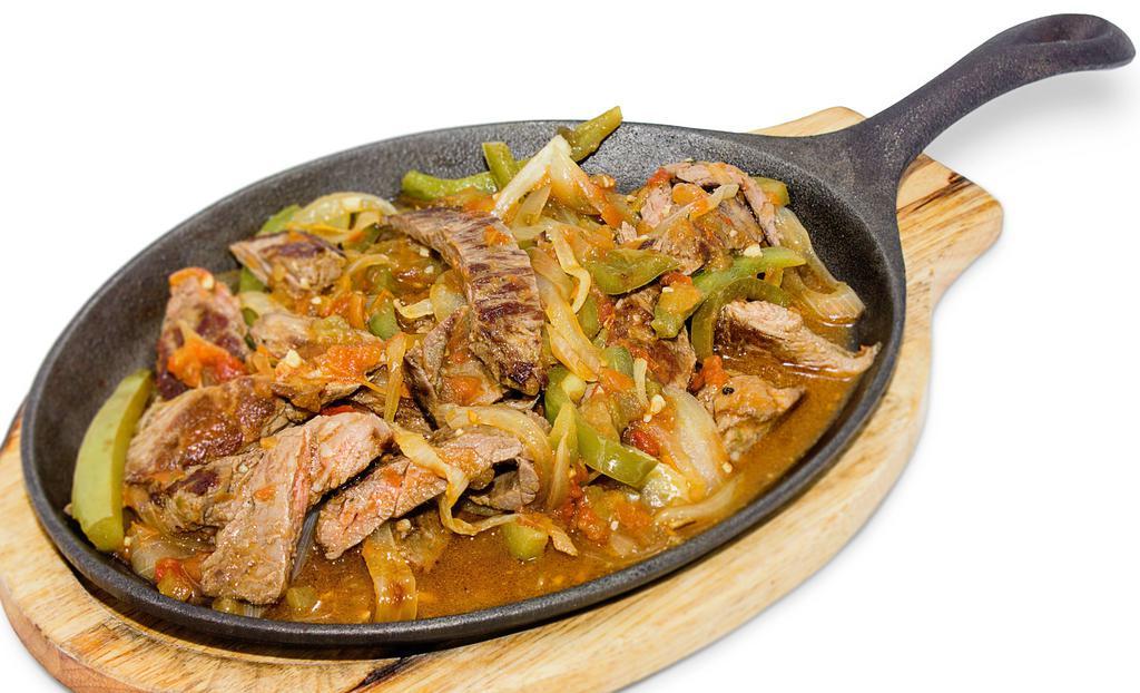Steak Fajitas · Strips of carne asada sauteed with tomatoes, green bell peppers and onions. Served with 2 side orders and one tortilla.