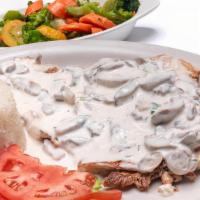 Grilled Chicken Breast With Mushrooms. · Grilled chicken breast topped with creamy mushroom sauce. Served with 2 side orders and 1 to...