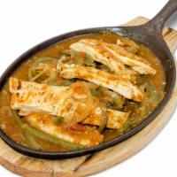 Chicken Fajitas · stripes of grilled chicken breast, sauteed with tomatoes, green bell peppers and onions. Ser...