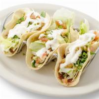 Vegetarian Tacos (3Pc) · 3 corn tortilla tacos filled with fried beans, lettuce, pico de gallo, sour cream garnished ...