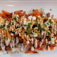 Buffalo Chicken Fries · Chopped buffalo chicken loaded on top of fries, melted cheese, buffalo sauce, and ranch dres...
