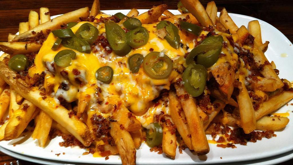 Jalapeno Pepper Fries · Fries covered in cheddar cheese sauce, bacon, ranch, shredded cheddar, jalapenos and jalapeno lime seasoning