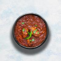 Madras Chicken · Tender boneless chicken pieces braised in a hot gravy made with traditional Madras style cur...