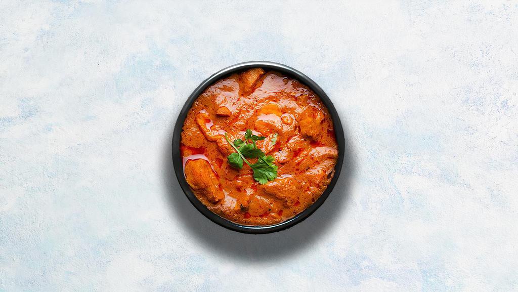 Chicken Tikka Masala · Oven-roasted chicken chunks in a rich creamy tomato and onion based gravy. Served with a portion of aromatic basmati rice.