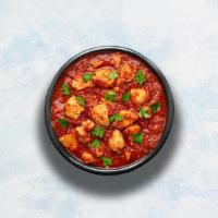 Chicken Vindaloo · Tender boneless chicken marinated in vinegar and garlic cooked to perfection with hot Indian...