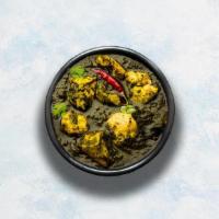Chicken Saag · Tender boneless chicken pieces slowly cooked in a rich spinach sauce. Served with a portion ...