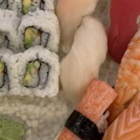 Deluxe (Two People) · 14 pcs of assorted sushi, california roll and spicy tuna roll.