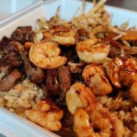 Steak & Shrimp W/2 Sides · A good portion of cubed grilled beef steak and medium shrimp, marinated in our homemade hous...