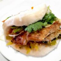 Bao Bun 刘包子 · Special selected meat flavored with secret sauces, served with pickled cabbage, cilantro, an...