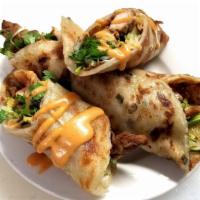 Scallion Pancake Roll 葱油卷饼 · Marinated meat and cooked perfectly with rich flavors, served with cucumber, cilantro and sc...