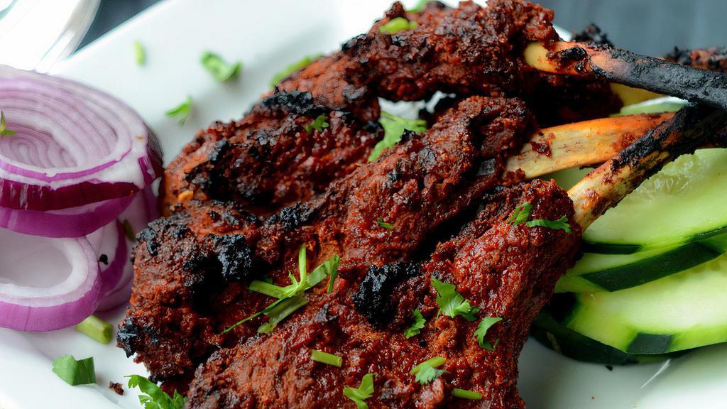 Lamb Chops (4Pcs) · Tender lamb chops marinated in our own Indian spices and char-grilled.