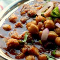 Channa Masala - Served With Basmati Rice · Garbanzo beans cooked with tomatoes.