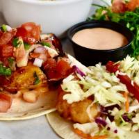 The Quatro · Choose your 3 favorite tacos served with a choice of a side.