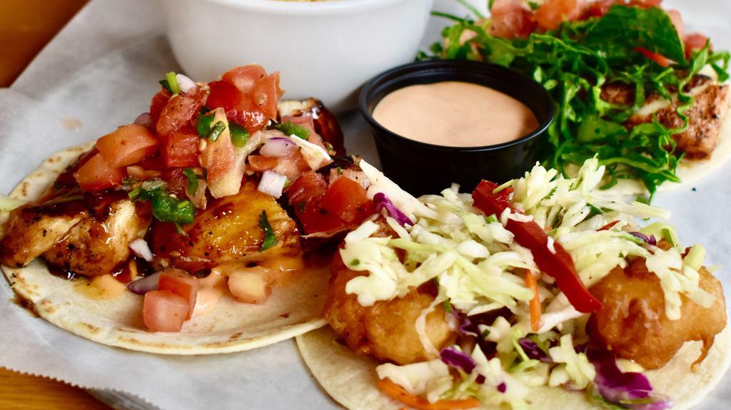 The Quatro
 · Choose your 3 favorite tacos served with the choice of a side