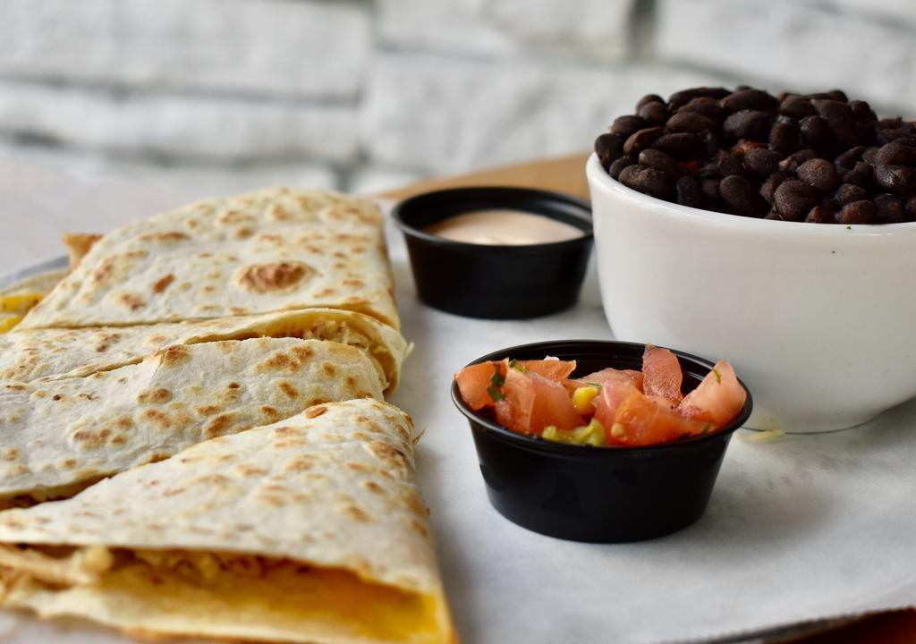 Quesadilla De Traditional · A blend of Mexican cheeses. Served with chipotle sour cream, pico de gallo, and a choice of side.
