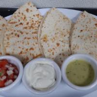 Quesadillas (Chicken, Grilled Steak And Vegetarian). · Served with pico de gallo, guacamole and sour cream.