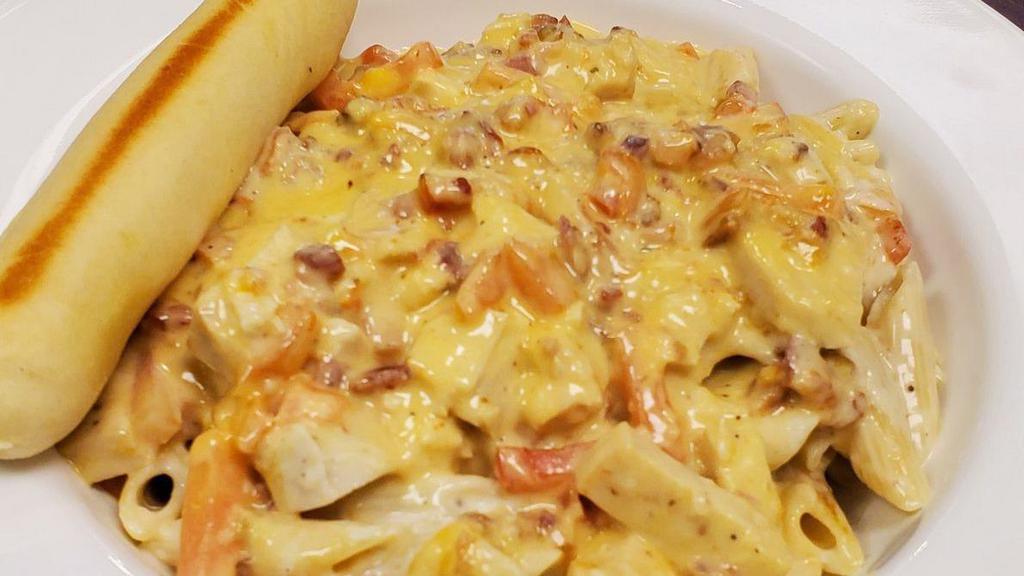 Chicken Bacon Ranch · Grilled chicken, bacon, tomatoes, cheddar cheese, cooked in ranch Alfredo sauce.