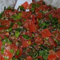 Tabouli Salad · Cracked bourghul, tomatoes, parsley, lemon juice, and olive oil over romaine hearts.
