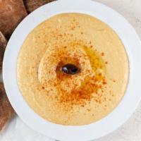 Hummus · Ground chickpeas with tahini, garlic, lemon juice and olive oil.
