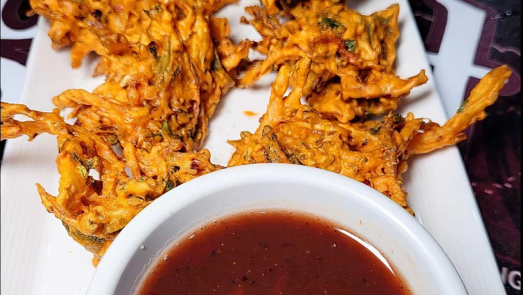 Vegetable Pakora · Ten pieces. Vegetable fritters deep fried in the special Indian batter mix.