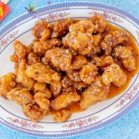 Sesame Chicken · Marinated tender breast batter fried golden brown, Served with spicy tangy sauce.