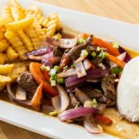 Lomo Saltado · Sauteed beef tenderloin, onions, tomato served with rice french fries.