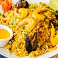 Arroz Con Mariscos · Yellow rice, seafood mix, green onion, peppers, sauce peruvian yellow chilli and cilantro.