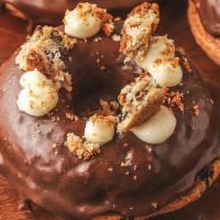 Chocolate Chip + Sea Salt Gf · Baked gluten-free chocolate chip cake, cocoa glaze, topped with chunks of chocolate chip coo...