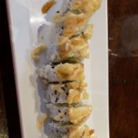 Georgia Roll · Salmon, shrimp tempura, cream chee, avocado, cucumber, topped with masago and fried snapper.