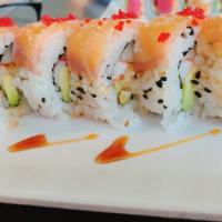 Super Rain Roll · Shrimp tempura, snow crab, avocado, cucumber and masago topped with smoked salmon.