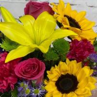 Floral Embrace · This vibrant bouquet delivers your sentiments to your someone special. A rich gathering of y...