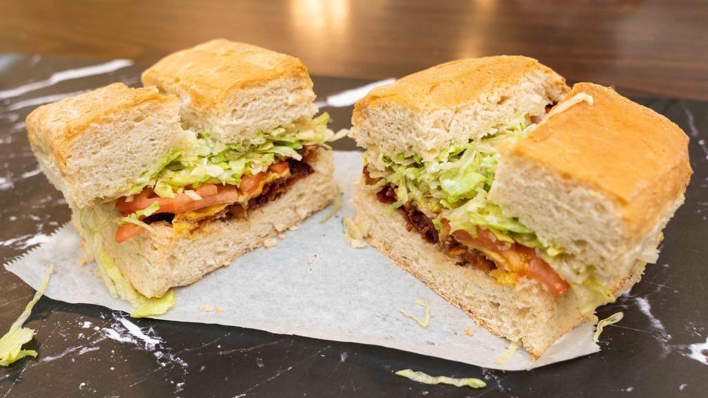 Blt Sub · Bacon, lettuce, tomatoes, mayonnaise, american cheese