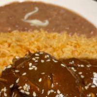 Chicken Mole · Boneless chicken simmered in a mole sauce consisting of multiple flavors including chile anc...