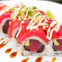 Tuna Lover Roll · Tuna and avocado topped with tuna, scallion, tempura flake, spicy mayonnaise and eel sauce.