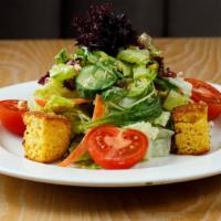 Perfect House Salad · hand cut field greens & gold coast vinaigrette with cucumber, carrots, corn, tomato & cornbr...