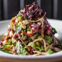 Grilled Chicken Salad · corn, cilantro & tortilla strips tossed in agave lime vinaigrette with a black bean drizzle