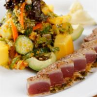 The #1 Tuna Salad · seared ahi with citrus ponzu alongside field greens, cucumber & mango in a carrot ginger dre...