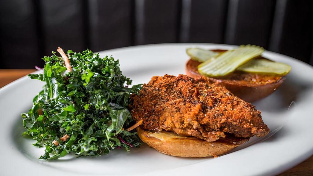 The Number Six · cajun buttermilk fried chicken with two slices of pickle along with roasted garlic dressing & habanero-honey sauce