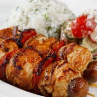 Grilled Chicken Kebabs · marinated grilled chicken over cilantro rice with a side of cucumber & feta salad
