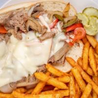 Philly Cheesesteak · Thinly sliced rib-eye steak with grilled onions, mushrooms, peppers, melted cheese served on...