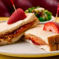 Pb & J Sandwich · Peanut butter & strawberry jelly, served with chips, slaw or french fries on choice of whole...