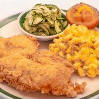 Crispy Fried Chicken · Fried chicken breast blue plate served w/ 2 sides and a corn muffin.