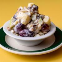 Waldorf Salad · Granny smith apples, walnuts and red grapes tossed in a citrus dressing.