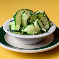 Marinated Cucumber Salad · Topped with sesame seeds.
