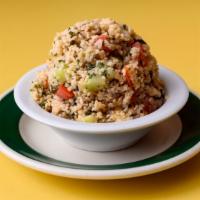 Tabouleh · Cracked wheat salad w/ cucumbers, tomatoes, parsley & mint.