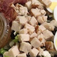 Cobb Salad · Chicken, bacon, choice of Bleu cheese or Feta cheese, romaine lettuce, egg, black olives, an...