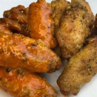 10 Pieces Wings · 10 piece wings tossed in our signature sauce. Uncle D's Atlanta Lemon Pepper wings or toss i...