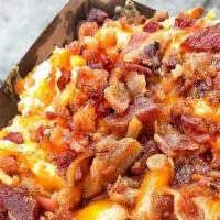 Bacon & Cheese Loaded Fries · Bacon, shredded cheese, jalapeños.